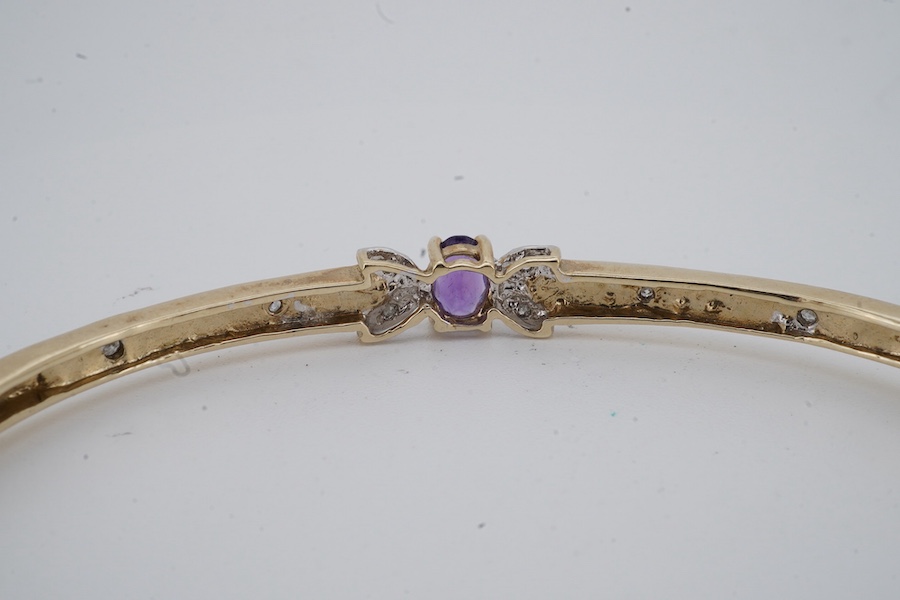 An amethyst and diamond bangle, inner circumference 17.5cm, mounted in gold, gross weight 7 grams; and an Edwardian bar brooch designed as an insect, set with a circular-cut aquamarine and seed pearls, mounted in gold, l